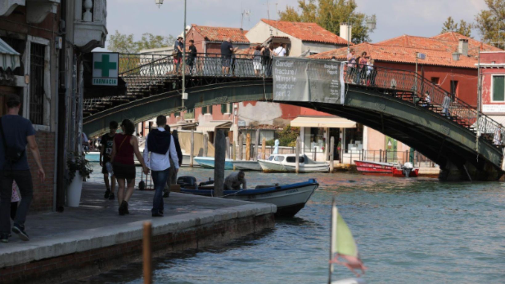 A view of a canal and bridge in Murano, Italy